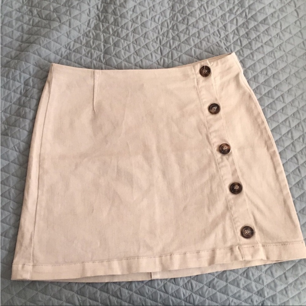 Others follow mini skirt. Beige